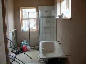 Bathroom fitting out with bath in place